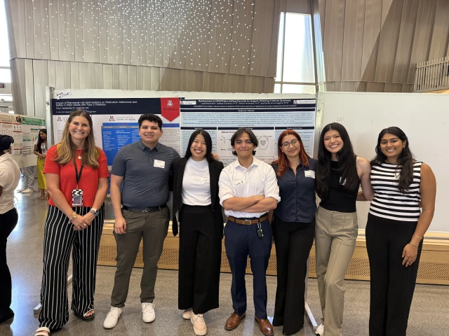 Group of students presenting at poster session