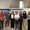 Group of students presenting at poster session